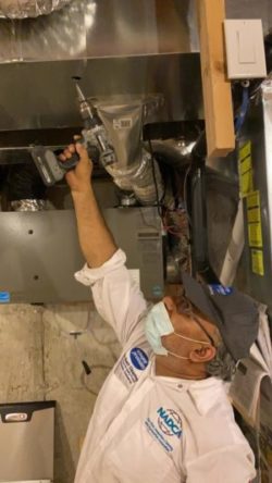 Duct cleaning hook-up in a basement furnace room