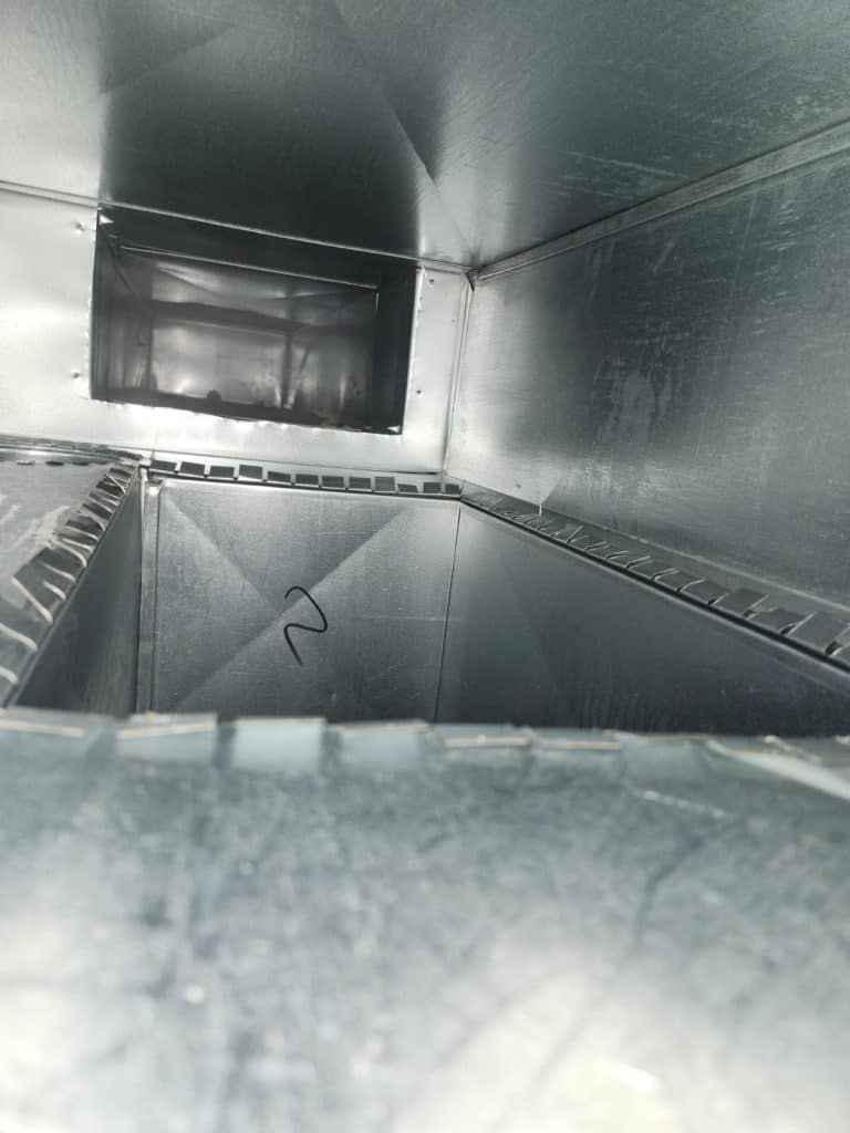 Inside ductwork during duct cleaning