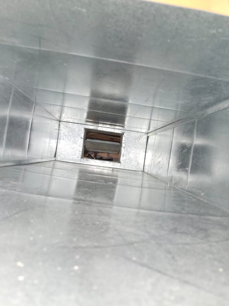 Inside ductwork during duct cleaning