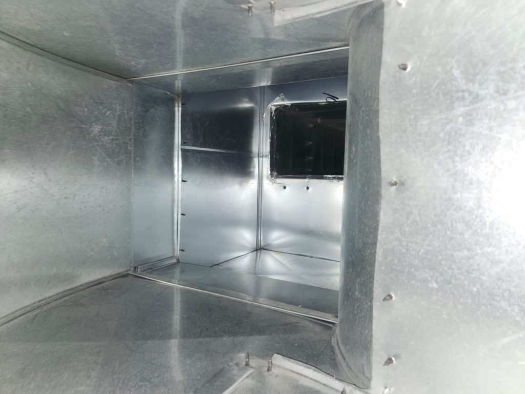 Inside ductwork during duct cleaning