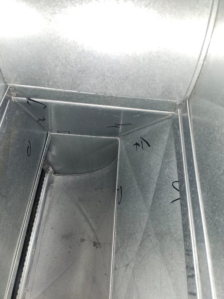 Inside ductwork during duct cleaning